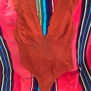 Burnt orange free people body suit NWT